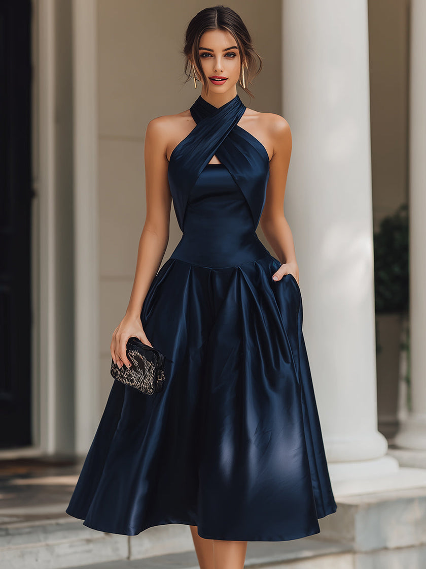 FJØRNA cross-halter pleated midi dress for women, showcasing a flowy, elegant design with pleats and a stylish halter neckline.
