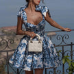 Blue floral off-shoulder mini dress by FJØRNA featuring a stylish design, perfect for elegant party wear.