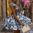 Blue floral off-shoulder mini dress by FJØRNA, perfect for elegant parties, featuring a fitted bodice and ruffled sleeves.