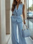 Light blue sleeveless two-piece trouser set with patch pockets by FJØRNA, featuring stylish pants and matching top.