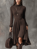 FJØRNA retro high-neck long-sleeved ribbed knitted midi dress displayed on a hanger, showcasing its fitted silhouette and textured fabric.