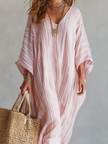 FJØRNA bohemian pink striped maxi dress featuring soft fabric and relaxed fit, perfect for casual summer wear.