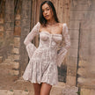 FJØRNA white lace mini dress with long sleeves, fitted silhouette, and intricate lace details, perfect for stylish occasions.