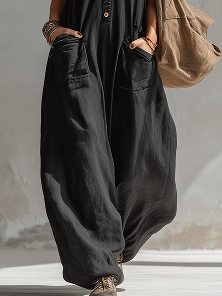 Black cotton linen sleeveless jumpsuit for women by FJØRNA, featuring a relaxed fit and stylish design.