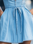 Light wash halter denim flare dress for women by FJØRNA, featuring a stylish blue denim design and flattering fit.