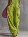 Bright green cotton linen jumpsuit by FJØRNA with a front zipper, featuring a relaxed fit and casual style.
