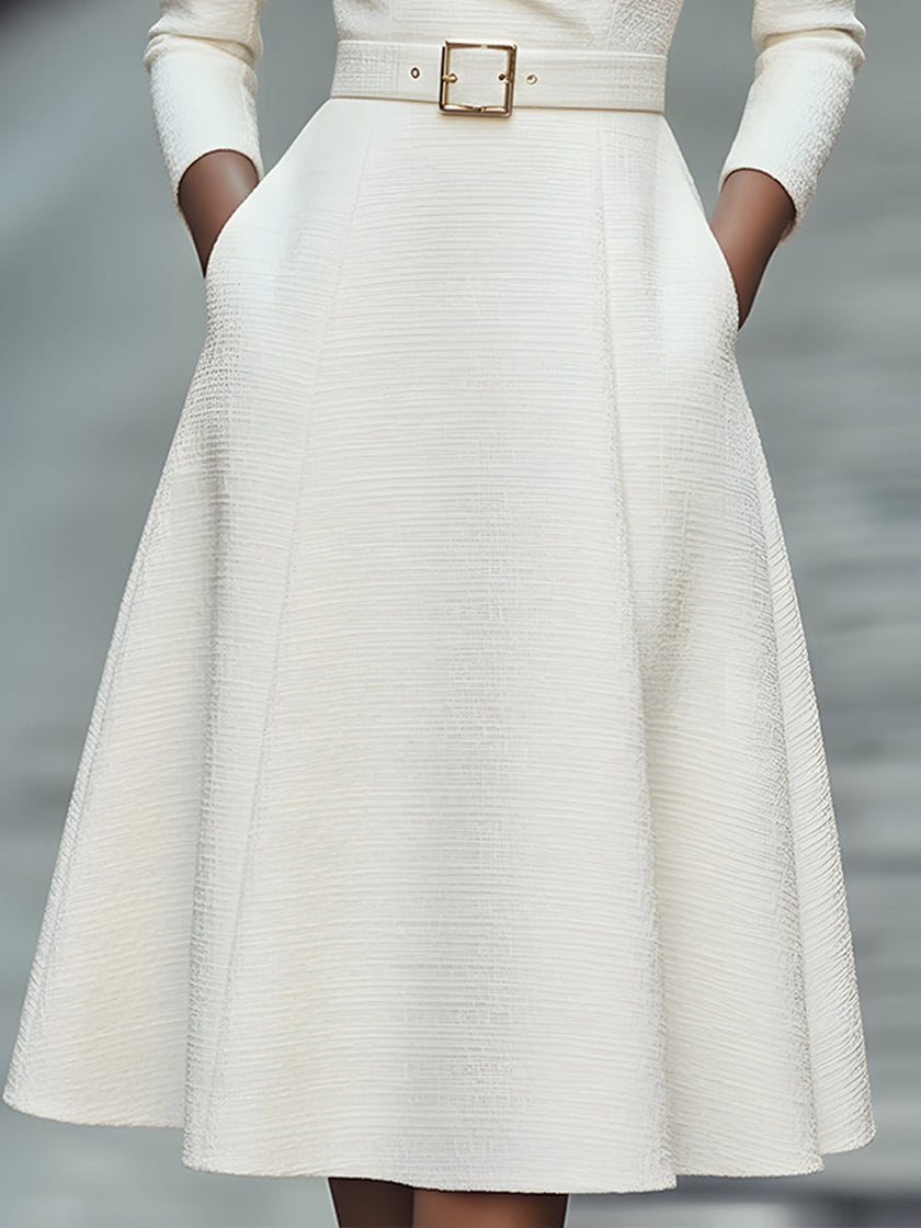 White textured belted midi dress with V-neckline by FJØRNA, stylish women's dress featuring a fitted waist and elegant design.