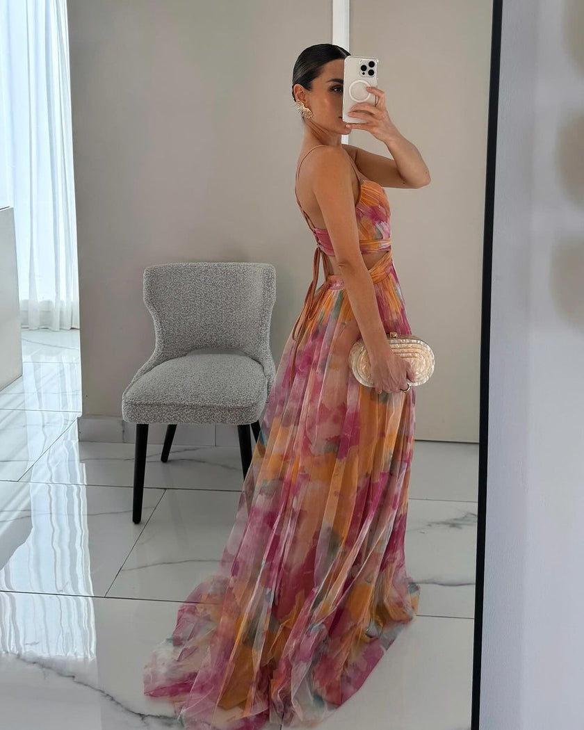 Elegant women's flowy evening dress by FJØRNA, showcasing a stylish, lightweight fabric and graceful fit perfect for formal occasions.
