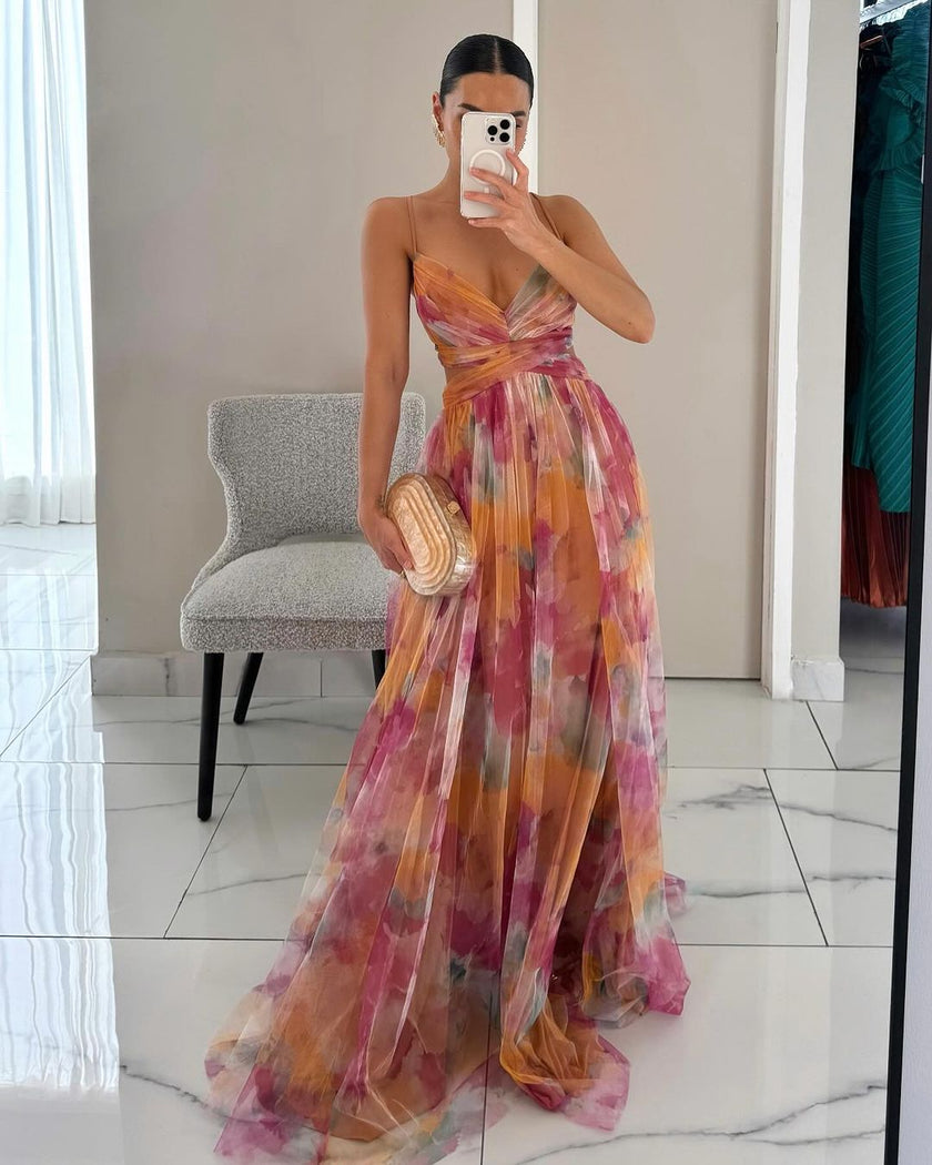 Elegant FJØRNA women's flowy evening dress with long sleeves and soft fabric, perfect for elegant occasions.