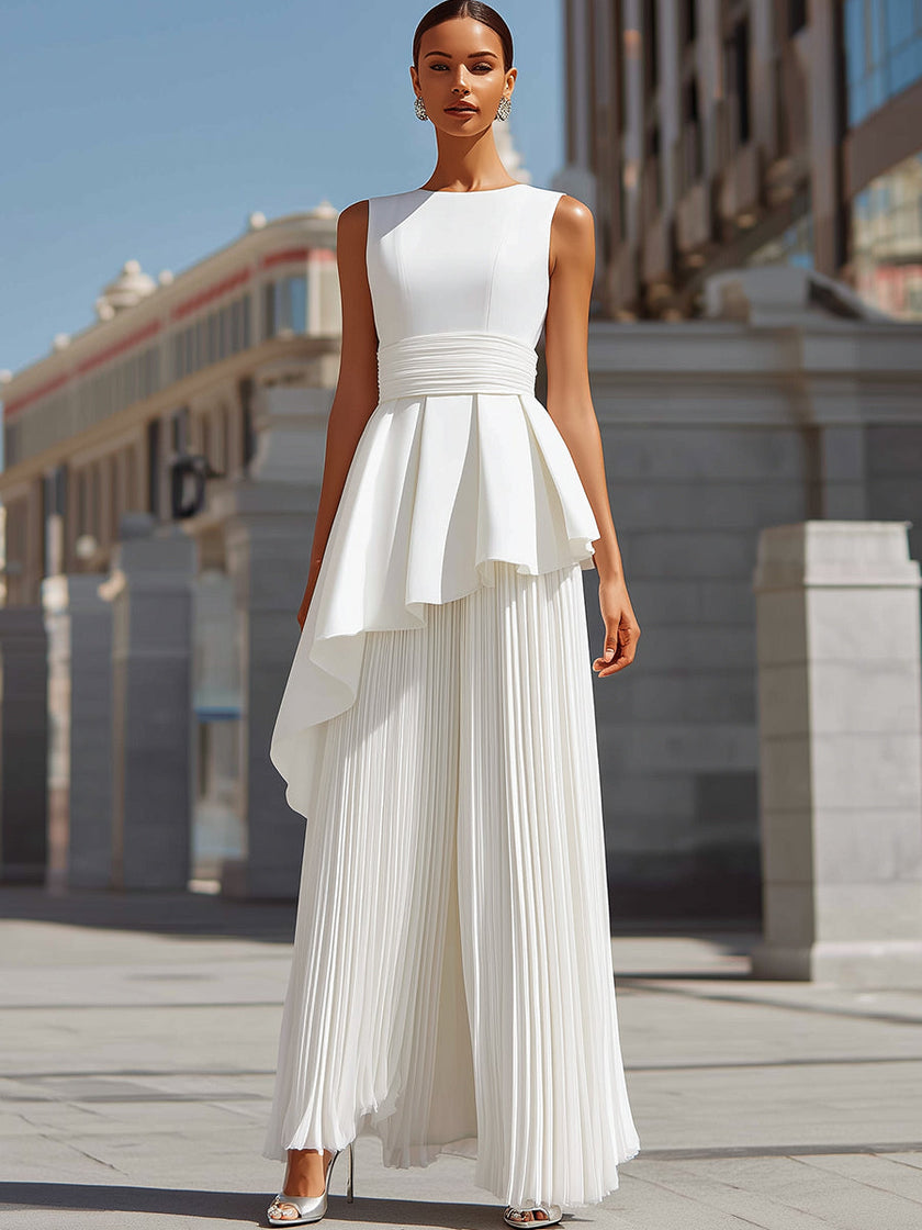 FJØRNA white maxi dress for women featuring sculpted asymmetric peplum and pleated design, perfect for elegant occasions.