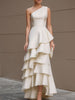 Ivory one-shoulder tiered ruffle gown by FJØRNA, stylish white maxi dress for women with flowing fabric and elegant design.