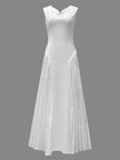 White FJØRNA A-line maxi dress with loose pleats and V-neck, featuring solid color and flowing silhouette.