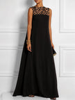 FJØRNA white sleeveless maxi dress with hollow split-joint design, round neck, and solid color, flowing and elegant.
