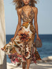 FJØRNA halter neck midi dress with leopard and floral print, featuring a stylish design and flowy fabric.