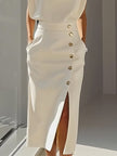 FJØRNA high waisted split-front maxi dress with elegant design, flowing fabric, and a sophisticated silhouette.