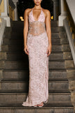 Pink Amina Maxi Dress by FJØRNA displayed on a hanger with flowing fabric and intricate details.