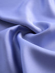Lavender satin women’s blouse with cross neckline and gathered sleeveless design by FJØRNA, stylish and elegant top.