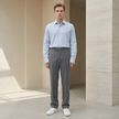 FJØRNA men's straight leg tailored trousers with a relaxed fit, showcasing classic style and smooth fabric.