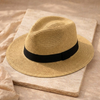 Men's FJØRNA Carolous handcrafted Panama hat with a wide brim and classic style, featuring natural straw textures and a stylish band.