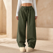 FJØRNA men's corduroy wide leg trousers with relaxed fit, showcasing their textured fabric and stylish tailored design.