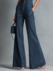 Dark denim flared jumpsuit for women with high neck, zipper front, sleeveless design, by FJØRNA.