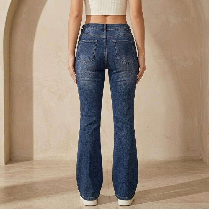 Women’s mid waist stretch flared denim jeans by FJØRNA, showing the fitted waistband and flared leg design.