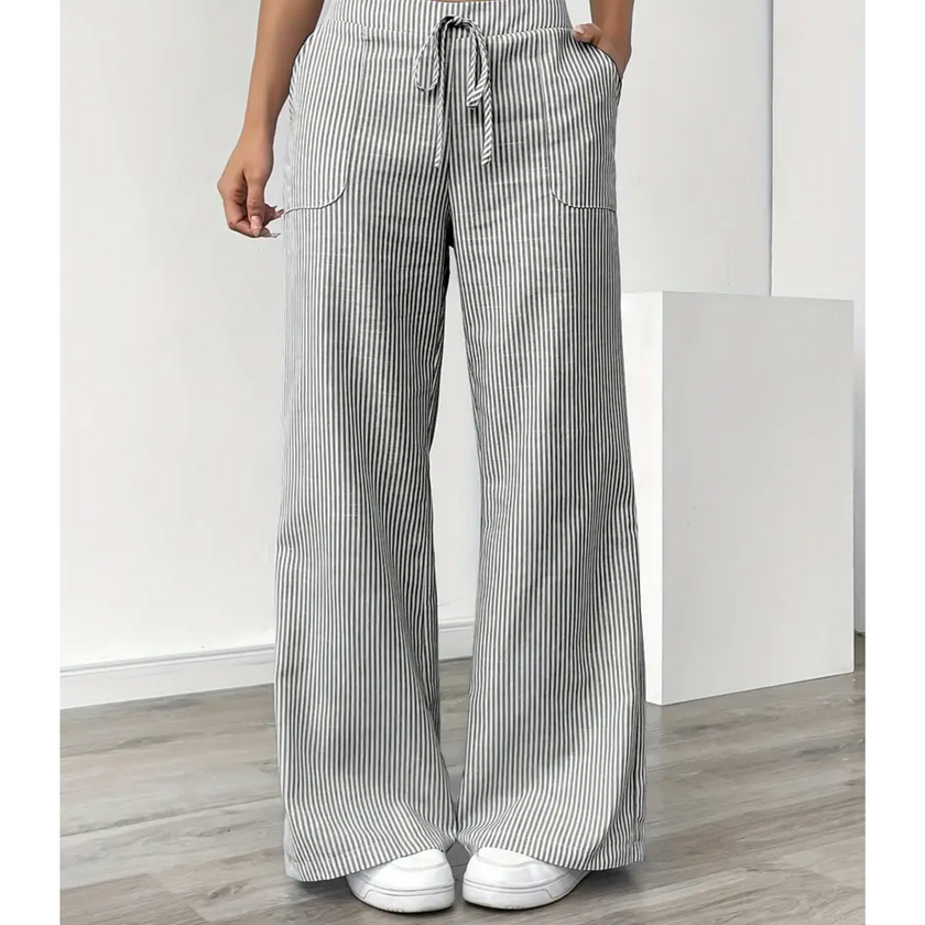 FJØRNA women's lightweight summer trousers with drawstring waist, breathable fabric, and side pockets for casual comfort.