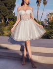 Pink tulle cocktail dress for women by FJØRNA, featuring a fitted bodice and flowing skirt perfect for special occasions.