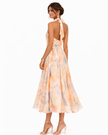 FJØRNA elegant maxi dress for women with a printed halter neck design, flowing fabric and stylish silhouette.