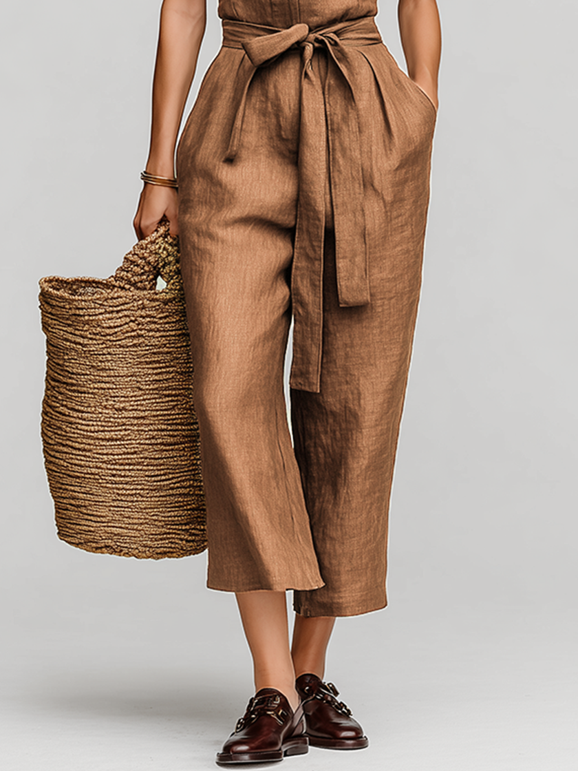 FJØRNA women's linen jumpsuit with collared V-neck, self-tie waist, and pants style, ideal for resort wear.