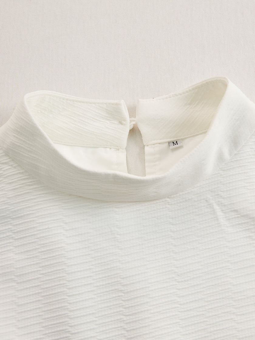 Cream textured lantern sleeve two-piece pants set by FJØRNA featuring a stylish, comfortable design with textured fabric and lantern sleeves.