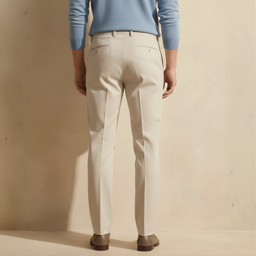FJØRNA men's straight leg trousers, stylish and tailored pants for men, shown in a neutral color on a model.