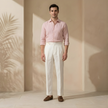 FJØRNA men's linen straight leg trousers with high waist and pleated design, showcasing a relaxed fit and classic style.