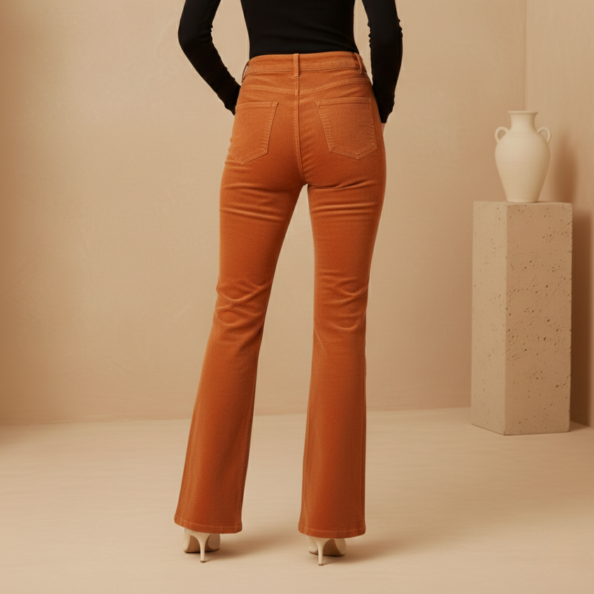 FJØRNA women's high waist flared trousers, stylish pants with a fitted waist and flowing flare design, shown on a model.