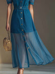 Blue denim V-neck short-sleeved maxi dress by FJØRNA featuring sheer organza fabric and a flowing silhouette.