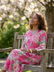 FJØRNA women's summer midi dress with floral pattern, long sleeves, and flowy design perfect for warm weather.