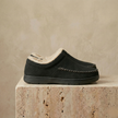 FJØRNA men's slip-on slippers featuring soft fabric upper and cushioned sole for comfortable indoor wear.