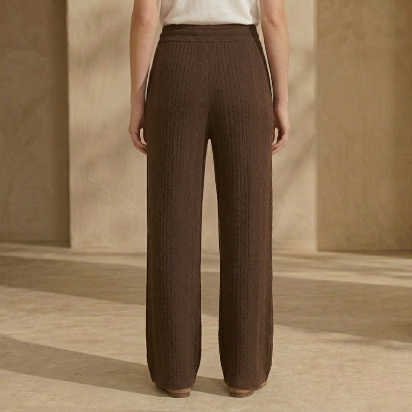 FJØRNA women's knit lounge trousers featuring cable-knit design, comfortable relaxed fit, and soft, cozy fabric.