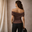 FJØRNA women's top, stylish casual blouse with long sleeves and soft fabric, shown on a model.