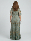 FJØRNA women's floral halter neck maxi dress featuring a flowing silhouette and elegant design for summer occasions.