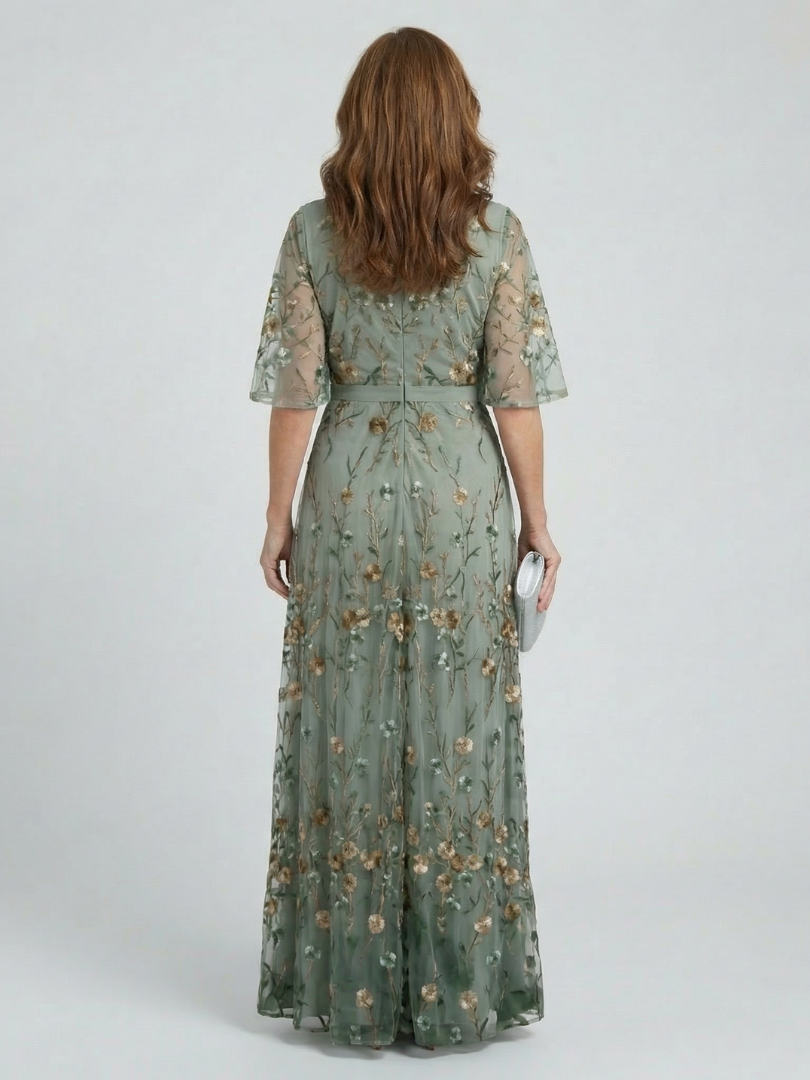 FJØRNA women's floral halter neck maxi dress featuring a flowing silhouette and elegant design for summer occasions.