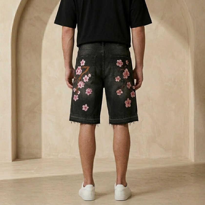 FJØRNA men's denim shorts with a floral pattern, casual summer shorts, blue denim fabric, front view showing design details.