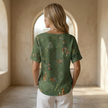 FJØRNA men's top in neutral color, featuring a relaxed fit with short sleeves and casual style, suitable for everyday wear.