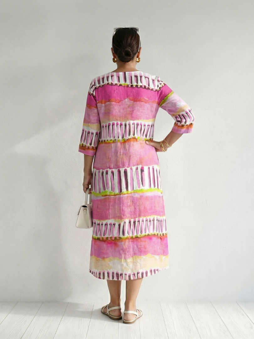 FJØRNA women's summer midi dress with long sleeves, striped pattern, flowy relaxed fit, perfect for warm weather.