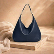 Large leather bag for women by FJØRNA, stylish and spacious handbag with sturdy leather material and elegant design.