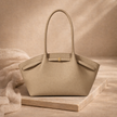 FJØRNA women's large travel tote bag made of durable fabric, featuring sturdy handles and spacious interior for travel essentials.