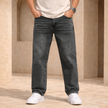 Men's relaxed fit denim jeans from FJØRNA, showing classic blue denim with a five-pocket design and belt loops.