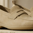 FJØRNA men's suede slip-on loafers with breathable design, showcasing the sleek, stylish footwear on a neutral background.