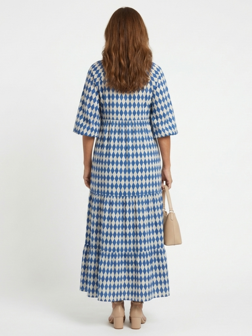 FJØRNA women's summer midi dress with a colorful print and wrap design, perfect for warm weather and casual occasions.