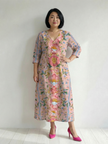 FJØRNA women's floral summer midi dress with long sleeves, wrap style, flowy fabric, perfect for warm weather.